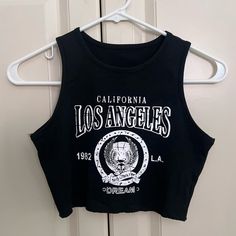 Shein Los Angeles Black Halter Racer Back Crop Top Nwot Size Xs Shein, Crop, Tops, Crop Top, Racerback, Halter, Halter Top, High Neck, Black, Black Crop Top, Tank, Brandy, Brandy Melville, Casual, Summer, Xs, Trendy, Nwot, Hem, La, Los Angeles, California, Ca, Cali Y2k Black Tank Top With Letter Print, Casual Letter Print Tank Crop Top, Black Letter Print Crop Top For Summer, Black Letter Print Tank Top For Spring, Chic Black Crop Top For Streetwear, Casual Cropped Letter Print Tank Top, Black Cropped Tops With Letter Print, Black Crop Top Tank For Streetwear, Trendy Black Tank Crop Top