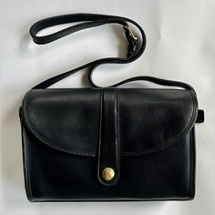 Selling Rare Vintage Coach Roll Crossbody Bag #9897 In The Color Black Serial Number Stamped In The Bag Is No 0756-126 Original Owner In Unused, New Condition. The Bag Is In Perfect Shape! Purchased Between 1991-1992. Stored In An Original Coach Box. Made In The United States Attached Original Coach Key Fob Fold Over Front Flap Brass Spring-Lock Pull Closure Interior Zipped Pocket Front And Back Slip Pocket Adjustable Strap Is 44" Long Dimensions Are 11 1/4" X 7 1/4" X 3 1/2" Contact Me With Any Elegant Flap Satchel, Classic Flap Bag With Removable Pouch For Shopping, Classic Satchel Shoulder Bag With Dust Bag, Classic Crossbody Shoulder Bag With Dust Bag, Classic Satchel Flap Bag For Shopping, Classic Evening Bag With Flap, Classic Tote Bag With Magnetic Closure, Classic Black Flap Bag For Shopping, Classic Clutch Shoulder Bag