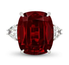 This glamorous ring showcases an incomparable brilliant-cut spinel that weighs a monumental 33.10 carats. The stone, which is certified by GemResearch Swisslabs, is entirely untreated, meaning its deep crimson color is nature-made. The spinel is flanked by two white diamonds weighing 2.27 carats, and all three gems are classically set in platinum. Though often mistaken for rubies or sapphires, spinels have experienced a surge in popularity in recent years due to their remarkable range of color a Golconda Diamond, Ruby Stone Ring, Red Diamond Ring, Flowers Rings, Crimson Color, Red Diamonds, Spinel Ring, Jewels Rings, Golden Ring