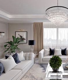 a living room filled with furniture and a chandelier