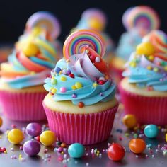 colorful cupcakes with candy and candies all around them