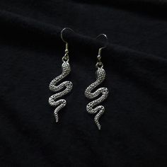 High quality, dainty sterling snake earrings. These sharp earrings are handcrafted with sterling silver ear hooks, and with proper care, will not tarnish so that you may wear these anytime. Earrings are packaged with an anti-tarnishing rag so that you may brighten them up and keep them sparkling. Rubber earrings backs are attached so that you never have to worry about losing them. These incredible earrings are lightweight and the perfect gift for anyone- even yourself! If you have any questions Sharp Earrings, Rubber Earrings, Snake Earrings, Ear Hook, Earring Backs, Etsy Earrings, You Never, Dangle Drop Earrings, Sparkle