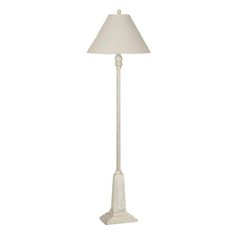 a white floor lamp with a shade on the base and a light in the middle