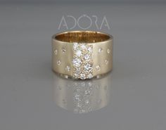 a gold ring with diamonds on it