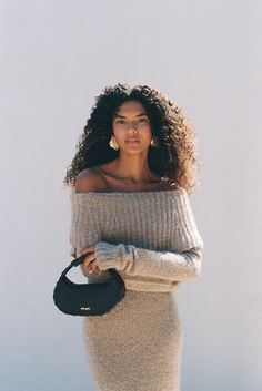 A midi-length, off the shoulder knit dress with ribbing details. — Midi length — Off the shoulder — Ribbed knit details — Body hugging silhouette Off The Shoulder Knit, Hugging Silhouette, Swimming Bag, Cult Gaia, Candle Collection, Kids Sandals, Cozy Fall, Beach Dresses, Leather Jewelry