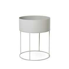 a white round table with metal stand