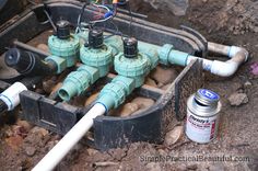 an electrical box filled with water pipes and some wires attached to the back of it