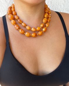 Vintage Amber Jewelry With Large Beads, Vintage Polished Beads Necklaces, Vintage Large Beads Jewelry, Vintage Amber Jewelry With Colorful Beads, Vintage Multi-strand Necklaces With Polished Beads, Vintage Double Strand Beaded Chain Necklace, Vintage Multi-strand Necklace With Large Beads, Vintage Double Strand Beaded Chain Necklaces, Vintage Double Strand Beaded Necklaces With Large Beads