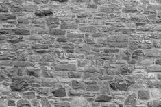 black and white photograph of an old brick wall