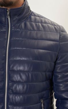 DETAILS This is not your typical sporty nylon puffer. Our signature leather puffer jacket is made from supple lambskin leather, quilted, fully lined and filled to ensure warmth all winter long. Microfiber insulation for warmth, YKK zipper front, YKK Zipper Hoody Pocket and 2 YKK zippered hand pockets 100% Polyester lining for insulation. Interior left side chest pocket and polished nickel zipper finishing SIZE + FITDesigned for a tailored fit. Fit model wears a medium, his measurements : chest 3 Winter Leather Puffer Jacket For Cold Weather, Casual Leather Puffer Jacket For Cold Weather, Luxury Quilted Puffer Jacket For Cold Weather, Winter Leather Jacket Quilted, Quilted Leather Puffer Jacket For Cold Weather, Quilted Leather Puffer Jacket, Leather Puffer Jacket With Long Sleeves, Quilted Leather Puffer Jacket With Long Sleeves, Leather Puffer Jacket With Padded Collar