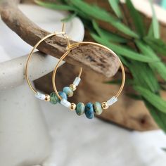 These unique and lightweight elegant 18k gold plated hoops are strung with a mix of Apatite Gemstone, Czech glass beads in sea blue/green with a touch of gold and 3mm gold filled beads. They are then finished with tiny Miyuki Japanese seed beads. Easy to wear and would be great for summer and holiday wardrobes! All items come carefully packaged ready for gifting in sparkly tissue paper and a small jute bag with seaside charm. A white logo'd gift box is available for a small additional cost. Please select from variations. Why not browse our shop and take a look at our other listings. www.etsy.com/uk/shop/CraftyCurlewStudio Item Details -  25mm 18k gold plated stainless steel hoops. Czech glass beads  3mm 14k gold filled beads 1.6mm Miyuki seed beads Delivery - We aim to post all orders the Small Jute Bags, Selling Photography, Brass Hoop Earrings, Beach Earrings, Big Hoop Earrings, Holiday Summer, Unique Gifts For Women, Beaded Wrap Bracelets, Summer Boho