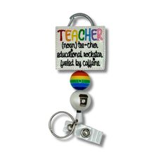 Show off your teacher pride with this whimsical Teacher Definition Badge Reel! Featuring a colorful design and bold definition of "teacher", this practical piece of flair will let people know who you are and what you do! Now you can stay securely connected to your ID, with a little extra personality. Personalized Multicolor Badge Reel For Teacher Appreciation, Novelty Adjustable Badge Holders For School, Customizable Multicolor Badge Holders For School, Fun Multicolor Adjustable Badge Holders, Personalized Multicolor Novelty Badge Holders, Teacher Definition, Know Who You Are, Colorful Design, Badge Reel