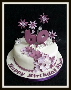 a birthday cake decorated with flowers and the number 50