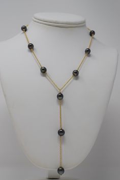 A sexy, modern design with exotic Tahitian black pearls. 🤍 Materials- 8 mm near-round, high grade, black Tahitian pearls (with overtones of green, blue, purple, and pink), gold filled chain and lobster clasp SizeLength: 17” chain with 4” drop Note* All jewelry is lovingly handmade by me. Quantities are limited. Craftsmanship is guaranteed. Orders arrive gift wrapped and ready for giving. Please allow 5-7 business days for production. Elegant Gold Tahitian Pearl Necklaces, Luxury Black Necklace With Pearl Pendant, Luxury Black Pearl Necklace With Round Beads, Elegant Gold Tahitian Pearl Necklace, Luxury Black Pearl Chain Necklace, Luxury Black Single Strand Pearl Necklace, Gold Tahitian Pearl Single Strand Necklace, Gold Necklace With Tahitian Pearl Round Beads, Formal Gold Necklace With Tahitian Pearl