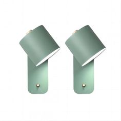 two green wall lights with one light on each side and the other off to the side