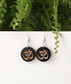 Om Symbol Wooden earrings Yoga jewllery ♥Handmade item ♥Materials: Wood ♥Sterling silver / Gold plated Ear Hooks ♥Lightweight earrings ♥Great gift for women ♥Gift boxing is included on all orders All of our wood designs are hand drawn or digitally designed by us to give you a one of a kind product. We use a professional laser cut for all of our wood products and designs. All designs and photographs 2020 ©UsingShapes™ Wooden Earrings Handmade, Yoga Earrings, Yoga Lover Gift, Om Symbol, Wood Designs, Spiritual Symbols, Great Gifts For Women, Lightweight Earrings, Wood Products