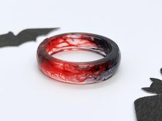 ⭐CHRISTMAS LAST POSTAGE: DEC 10 ⭐ The holiday season is here, and we want to ensure your gifts arrive in time for Christmas! Please place your orders before December 10th as orders after this date may not arrive in time for Christmas!  ❤️ Blood Red Resin Ring  ❤️ A vampire-inspired resin ring with black and red swirling resin. ✨ Perfect for your witchy-halloween outfits, or just regular dark academia inspired fits 🩸 matching jewelry is available on my page 🪄 These are lovingly handmade to orde Red Rings For Halloween Gift, Black And Red Rings, Vampire Rings, Blood Ring, Vampire Ring, Vampire Fashion, Witchy Gifts, Witchy Halloween, Red Rings