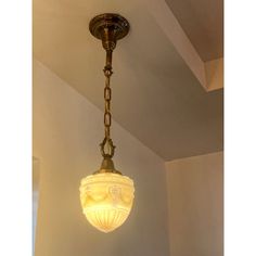 a light fixture hanging from the ceiling in a room