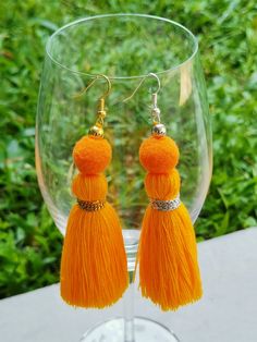 Tassel earrings in a variety of colors make a great gift! a perfect statement earring for those with sensitive ears! Weight: 0.08 ounce each Droplength: 4 Inches from the top of the earwire. These are handmade products. Made from threads and breads. lightweight. Colors may vary slightly due to screen settings. Summer Dangle Tassel Earrings, Gold Latkans Earrings For Beach, Gold Earrings With Latkans For The Beach, Gold Latkan Earrings For The Beach, Yellow Tassel Earrings As Gift, Yellow Dangle Jewelry With Tassels, Bohemian Beaded Earrings With Latkans For Summer, Adjustable Yellow Bohemian Tassel Earrings, Yellow Bohemian Adjustable Tassel Earrings