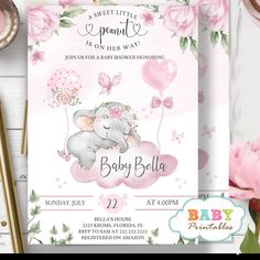 an elephant baby shower party with pink flowers and balloons