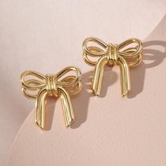 Brand New In Box Minimalist Designed Bow Earrings Features A Cute Ribbon Shape That Pierces The Earlobe. These Small Bow Earrings Can Be A Cute And Elegant Addition To Your Jewelry Collection. Add A Touch Of Elegance And Sophistication To Any Daily Look. Gold Bow Earrings - Measure 0.78inches High, 0.67 Inches Wide.It's Light Weight And Comfortable For Wearing. 14k Gold Plated. Gold Earrings For Valentine's Day Formal, Gold Earrings For Valentine's Day Formal Occasion, Formal Gold Earrings For Valentine's Day, Dainty Earrings For Valentine's Day Party, Gold Earrings For Mother's Day Party, Elegant Gold Earrings For Mother's Day, Dainty Valentine's Day Party Earrings, Gold Plated Earrings For Valentine's Day Formal, Gold Plated Earrings For Valentine's Day Formal Occasions