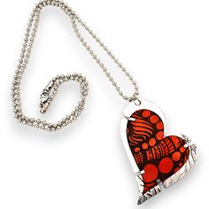 Enamel & Steel Necklace - Made from recycled copper, this heart pendant showcases a stunning laser engraved design that radiates charm and sophistication; its enameled finish adds a touch of vibrant color. Set on non-tarnish, roller-printed stainless steel; lobster clasp closure. Handmade Heart-shaped Enamel Jewelry, Silver Enamel Heart Pendant Necklace, Heart-shaped Orange Necklace For Gift, Heart-shaped Orange Jewelry For Gift, Orange Heart Charm Jewelry, Orange Heart-shaped Jewelry Gift, Mixed Media Necklace, Shrinky Dink, Heart Pendants