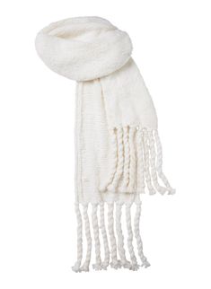 The Lily Scarf is handknit from a luxurious blend of cashmere, silk, and wool in a soft white hue. This oversized scarf features voluminous tassels and a brushed texture, showcasing artisanal craftsmanship with every stitch. Shop Accessories. Styling Tip: Drape over a tailored coat or chunky knit for a cozy yet elevated cold-weather look. Chunky White Scarf, Statement Necklace Outfit, Accessories Styling, Necklace Outfit, Cute Scarfs, Stitch Shop, White Scarf, Tailored Coat, White Scarves