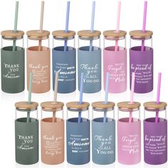 many different colored tumblers with straws in them and thank you written on the lids