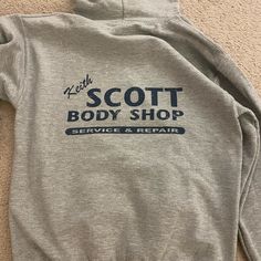 Keith Scott Body Shop Hoodie. Purchased From Oth Gift Shop In Wilmington Nc! Never Worn. One Tree Hill Sweatshirt, Gray Fitted Cotton Sweatshirt, Keith Scott Body Shop, Keith Scott, Jordan Birthday, Brown Puffer, Black Winter Coat, Trim Jacket, Single Button Blazer