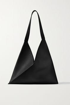 Khaite's 'Sara' tote has been made in Italy from smooth leather with geometric panels, giving it a sculptural silhouette. The small, suede-lined interior offers just enough space for a cardholder, phone and keys, while the long straps ensure it slings comfortably over your shoulder. Unique Tote Bag, Black Leather Tote Bag, Black Leather Tote, Bag Design, Bags Designer Fashion, Leather Tote Bag, Womens Tote Bags, Smooth Leather, Leather Tote