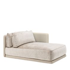 a white couch with two pillows on it's back and one arm folded up to the side