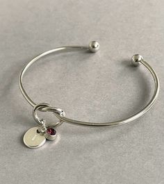 Pretty silver initial amethyst birthstone bracelet bangle - an ideal personalised gift for a loved one or would make a lovely personalised gift for a Bridesmaid. A gift note can be added (any text can be written) just remember to add the note in the 'personalisation box'. + Bangle is adjustable so will fit most girls and women (to tighten the bangle gently squeeze it to make it smaller) + Silver plated bangle + Silver plated initial charm + Silver plated birthstone charm + Disc initial charm mea Silver Knot Bracelet, Amethyst Birthstone, Bracelet Christmas, Birthstone Bracelet, Knot Bracelet, Christmas Gift For Her, Birthstone Bracelets, Initial Bracelet, November Birthstone