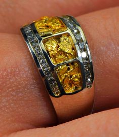 "Gold Nugget Ring \"Orocal\" RL1075DNW Genuine Hand Crafted Jewelry - One of a Kind - 14k Yellow Gold Casting - Approx. Total weight = 7.20G \" If this is not in Stock our Jeweler will make it in 4-6 weeks\" Specs and Dimensions: Length/Width Nugget Size - 7.5 Diamonds - .36ct - Total R stands for Ring L for Ladies, M Stands for Men and Q stands for the Quartz / E Stands for Earrings, and P stands for Pendants. Diamonds are G color High Quality Diamonds. With This Stunning Gold Nugget Ring you w Heirloom Nugget Rings As Gift, Silver Nugget Jewelry For Anniversary, Yellow Gold Nugget Fine Jewelry, Fine Jewelry In Yellow Gold Nugget Shape, Yellow 14k Gold Jewelry With Diamond Accents, Collectible Yellow Gold Rings With Diamond Accents, Fine Jewelry Yellow Gold Nugget, Yellow Gold Nugget Gemstone Jewelry, 14k Gold Nugget Ring With Diamond Cut