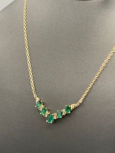 "This beautiful ladies 14 karat gold emerald and diamond necklace was designed and made in 14 karat solid yellow gold.  The central focus of the necklace is a graduated row of 5 natural oval emeralds and 8 fine white quality round diamonds prong set in between.  Finishing this beautiful necklace is a 14 karat gold Copenhagen chain secured a lobster claw lock.  Gorgeous on a woman's neck!! Weight-7.4 grams Length-16 ⅝\" Emeralds:1.75cts TDW: 0.33 cts Our Price $750.00 Regularly Priced At $1100.00 Please See Our Video  Remember - whether you're purchasing for yourself or a gift for a loved one, Buy With Confidence!  We Guarantee Everything We Sell!  SKU # N679" Emerald Diamond Necklace, Gold Coin Jewelry, Emerald And Diamond Necklace, Amethyst Bangle, Claw Necklace, Sapphire And Diamond Earrings, Vintage Sapphire, Coin Jewelry, Wedding Jewellery Necklace