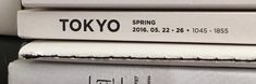 three books stacked on top of each other with the words tokyo written in black and white