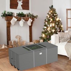 a living room with a christmas tree and presents on the floor in front of it