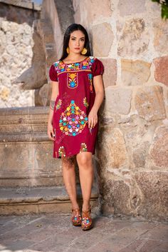 This Beautiful Floral embroidered Dress is the perfect dress to add to your wardrobe. -Its cute enough to dress up for a party or even just wear it to a picnic. -It's lightweight, handmade and hand embroidered by Mexican Artisans in Puebla, Mexico. Embroidered Cotton Mini Dresses, Fitted Folk Dresses With Multicolor Embroidery, Short Sleeve Cotton Dress With Geometric Embroidery, Cotton Dresses With Geometric Embroidery And Short Sleeves, Multicolor Embroidered Dress With Embroidered Sleeves, Bohemian Fitted Dress With Embroidered Sleeves, Fitted Bohemian Dress With Embroidered Sleeves, Embroidered Knee-length Mini Dress, Fitted Cotton Dress With Geometric Embroidery