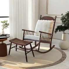 a rocking chair and ottoman in a living room