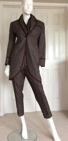 "Wonderful unworn three piece pantsuit from my private museum quality Romeo Gigli collection. This three piece set is great for casual business attire as well a# elegant evening attire. Romeo Gigli would have mixed the vest with other silk pieces in his collection. The pant would have been shown with his signature silk iridescent blouses. (I have put one of his silk blouses under the vest. Blouses are in separate listings) The pants pockets have excellent workmanship with bound closure and worki Fitted Winter Formal Pantsuit, Winter Formal Fitted Pantsuit, Fitted Brown Three-piece Suit For Office, Brown Three-piece Suit With Suit Collar For Fall, Brown Three-piece Suit For Fall With Suit Collar, Fitted Brown Formal Pantsuit, Fitted Wool Pantsuit For Fall, Elegant Fitted Brown Pantsuit, Brown Three-piece Suit For Fall Formal Occasions