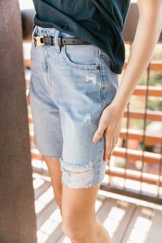 Introducing your warm weather uniform. Our Distressed Denim Dad Shorts are an essential in every Spring/Summer wardrobe, with a flattering high waisted fit and distressed bottom hem. When it comes to styling options, the opportunities are endless! Styled with out Icon Tee, St Tropez Tee, and Lowkey Famous Slides! High rise Non-stretch Distressed Dad shorts - longer length Front zip fly & button closure 100% Cotton Measurements are based on a size small Inseam: 7 inch Rise: 11 1/2 inch Childrens Shop, Dad Shorts, Spring Summer Wardrobe, Beach Collection, Top Graphic Tees, St Tropez, Distressed Denim Shorts, Western Wear, Summer Wardrobe