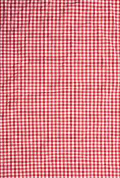 the red and white checkered fabric is very close to it's surface,