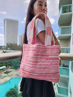 100% hand-knitted bags. Beautifully knitted over-shoulder bag with big capacity and stylish. You can wear it as a beach bag, for casual dinner with friends, or as a travel bag when you are traveling alone or with kids. Very comfy and soft to the touch. The color is white  with pink stripes. Large Capacity Pink Crochet Bag For Summer, Pink Crochet Tote Bag For Beach, Casual Pink Crochet Beach Bag, Large Capacity Pink Crochet Bag For Shopping, Summer Pink Crochet Shopping Bag, Traveling Alone, North Miami Beach, Dinner With Friends, Top Handle Bags