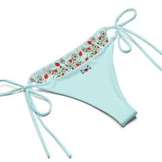 Stay comfortable and stylish all summer with this All-Over Print Recycled String Bikini set. It’s made from soft recycled polyester with double-layering and UPF 50+. Style the straps how you like, and get ready to swim! • Soft and stretchy material with UPF 50+ • Sizes up to 6XL • Bikini top comes with removable padding for comfort • Multiple ways to tie and style the bikini set • Color design options for swimwear lining Disclaimers: • Due to the 2-layered construction and internal stitching, a visible stitch may appear in the crotch seam of the bikini bottom. This is a normal part of the manufacturing process and does not impact the quality or performance of the product. • To make your All-Over Print Recycled String Bikini last longer, thoroughly rinse it off after each use and get rid of Spring Seamless Swimwear With Tie-side Bottom, Seamless Spring Swimwear With Tie-side Bottom, Seamless Summer Swimwear With Tie-side Bottom, Seamless Tie-side Bottom Swimwear For Spring, Seamless Tie-side Summer Swimwear, Seamless Tie-side Bottom Swimwear For Summer, Summer Seamless Tankini With Tie-side Bottom, Seamless Swimwear For Summer Festivals, Seamless Tie-side Tankini For Summer