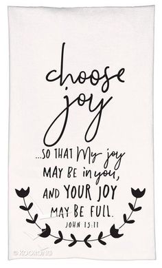 a white towel with the words choose joy written in black on it and an image of flowers