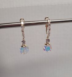 Alya's light iridescent dangle earrings Width: 1cm Height: 4cm Iridescent Dangle Crystal Earrings For Pierced Ears, Elegant Iridescent Sparkling Earrings, Iridescent Sparkling Earrings, Iridescent Hypoallergenic Earrings For Party, Hypoallergenic Iridescent Earrings For Parties, Iridescent Dangle Earrings For Wedding, Iridescent Drop Earrings, Elegant Iridescent Crystal Earrings For Pierced Ears, Iridescent Drop Earrings For Formal Occasions