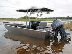 a motor boat is parked in the water