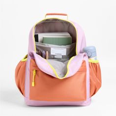 A backpack that's extra comfy and ready to handle all the adventures of the day. Combining colorblocks of purple and orange with pops of yellow trim, the kids' large knapsack is constructed of supremely durable polyester fabric that includes recycled plastic bottles. A roomy interior holds everything your kid needs-books, school supplies, extra layers-and there's a padded pocket to keep their tablet protected. Outside pockets hold snacks, water bottles and more. Pair this book bag with the match Playful Backpack For End Of School Year Outdoor Use, Playful Multicolor Outdoor Bag, Playful Pink Backpack For Outdoor Activities, Pink Nylon Backpack For School, Pink Nylon School Backpack, Playful Nylon Backpack, Playful Nylon School Bag, Functional Orange Backpack For School, Playful Nylon Standard Backpack