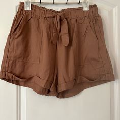 Brown High Waisted Dress Shorts. Slight Stretch Band Across Waist. Tie In Front Is Not Adjustable. Has Pockets. Note: Material Wrinkles Easily. Never Worn And New With Tags. Charolette Russe Brand And Size L. Spring Beach Shorts In Brown, Brown Relaxed Fit Shorts For Spring, Casual Tie Waist Shorts For Spring, Casual Summer Shorts For Brunch, Casual Shorts With Elastic Waistband For Brunch, Brown Vacation Shorts For Spring, High Waisted Dress, Dress Shorts, High Waist Dress