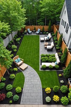 a backyard garden with lawn and seating area