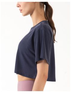 The EMES SHOP shirt is detailed with a high round neckline. and loose relaxed sleeves. Features a cropped. boxy over-sized fit. and a middle back seam detail. This soft. breathable. light-weight shirt is perfect to throw on over your favorite sports bra for a yoga/pilates class. morning run. a hike with friends. or any other workout in between. MATERIAL: 70% Modal. 30% Soft Poly MEASUREMENTS: Small Bust: 37.8" in Shoulder width: 17.1" in Length: 15.2" in Medium Bust: 39.4" in Shoulder width: 17.7" in Length: 15.7" in Large Bust: 40.9" in Shoulder width: 18.3" in Length: 16.3" in X-Large Bust: 42.5" in Shoulder width: 18.9" in Length: 16.9" in Effortless Boxy Crew Neck Top, Boxy Fit Crop Top For Everyday Wear, Boxy Cropped Tops, Sporty Oversized Crew Neck Crop Top, Oversized Sporty Crew Neck Crop Top, Boxy Crop Top For Everyday Wear, Basic Boxy Fit Cropped Tops, Solid Cropped Crew Neck T-shirt For Workout, Cropped T-shirt With Relaxed Fit For Workout